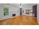 Spacious living room featuring a fireplace and an adjacent eat-in kitchen with barstool seating at 3524 Forest Downs Cv, Decatur, GA 30034