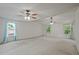 Large bedroom with bright windows and two ceiling fans at 3524 Forest Downs Cv, Decatur, GA 30034