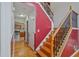 Beautiful staircase featuring hardwood treads and decorative wrought iron spindles at 3524 Forest Downs Cv, Decatur, GA 30034