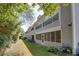 View of the rear facade of this apartment complex with screened patios at 72 Sutton Pl, Avondale Estates, GA 30002
