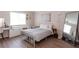 Bright bedroom with large window, a dressing table, and a full length mirror at 72 Sutton Pl, Avondale Estates, GA 30002