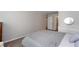 This bedroom has light walls, modern light fixtures, and an attached bathroom at 72 Sutton Pl, Avondale Estates, GA 30002