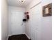 Interior entrance featuring a white door and closet with dark wood-look flooring at 72 Sutton Pl, Avondale Estates, GA 30002