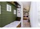 Hallway with bench seating leading to sitting room with natural light at 72 Sutton Pl, Avondale Estates, GA 30002