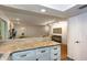 Open kitchen featuring granite countertops and breakfast bar, flowing into the living room at 72 Sutton Pl, Avondale Estates, GA 30002