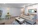 Bright open-concept living room with access to the dining area featuring updated flooring and modern furnishings at 72 Sutton Pl, Avondale Estates, GA 30002