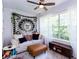 Bright room with a big window, ceiling fan, a comfy sofa and decor at 72 Sutton Pl, Avondale Estates, GA 30002