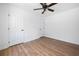 Bedroom with wood-look flooring, white walls, and natural light at 1080 Rackley Nw Way, Kennesaw, GA 30144