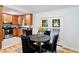 Efficient kitchen and dining area with stainless appliances and light filled dining space at 1080 Rackley Nw Way, Kennesaw, GA 30144