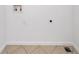 An empty laundry room with tile flooring and white walls, ready for appliances at 1080 Rackley Nw Way, Kennesaw, GA 30144