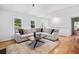 Inviting living area with lots of natural light, hardwood floors and comfortable seating at 1080 Rackley Nw Way, Kennesaw, GA 30144