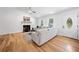 Bright living room with fireplace, hardwood floors, and views of the front yard at 1080 Rackley Nw Way, Kennesaw, GA 30144