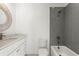 Bathroom featuring a modern vanity, toilet, and a tiled shower with gray accents at 2325 Mason Dr # D22, Atlanta, GA 30316