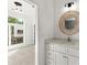 Modern bathroom featuring round mirror, vanity with drawers, and view to bedroom at 2325 Mason Dr # D22, Atlanta, GA 30316