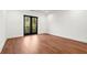 Spacious bedroom with hardwood floors and French doors leading to a private balcony at 2325 Mason Dr # D22, Atlanta, GA 30316