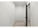 A small closet with carpet and a black-colored door at 2325 Mason Dr # D22, Atlanta, GA 30316