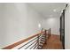 Upstairs hallway with hardwood floors, modern lighting, and sliding barn doors at 2325 Mason Dr # D22, Atlanta, GA 30316