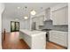 Bright, modern kitchen featuring stainless appliances, gray backsplash, and a large island for entertaining at 2325 Mason Dr # D22, Atlanta, GA 30316