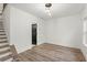 Bright living room with new hardwood floors, recessed lighting, and staircase at 2325 Mason Dr # D22, Atlanta, GA 30316