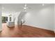 Open floor plan with hardwood flooring, flowing into a modern kitchen and staircase at 2325 Mason Dr # D22, Atlanta, GA 30316