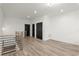 Second-floor loft area with modern railings, wood floors, and modern lighting at 2325 Mason Dr # D22, Atlanta, GA 30316