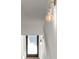 Close-up of an elegant sconce lighting on a white wall near the staircase landing at 2325 Mason Dr # D22, Atlanta, GA 30316