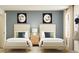 Charming bedroom features matching beds, coordinated decor, and a calming color palette at 255 Deer Valley Run, Canton, GA 30115