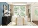 Bright dining room with large window, wooden table, sleek chairs, and stylish modern decor at 255 Deer Valley Run, Canton, GA 30115