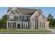 Stunning two-story home boasts a brick facade and charming shutters at 255 Deer Valley Run, Canton, GA 30115