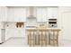 Modern kitchen with white cabinetry, stainless steel appliances, and island seating perfect for entertaining at 255 Deer Valley Run, Canton, GA 30115