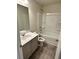 Full bathroom with tub/shower, toilet, tile floors and a grey vanity at 2832 Saratoga Lake Vw, Decatur, GA 30034