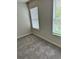 Bedroom with carpet, two windows and neutral walls, creating a relaxing space at 2832 Saratoga Lake Vw, Decatur, GA 30034