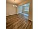 Dining area featuring hardwood floors and a modern chandelier at 2832 Saratoga Lake Vw, Decatur, GA 30034