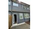 Back exterior of the house with dark siding and a fenced in patio at 2832 Saratoga Lake Vw, Decatur, GA 30034