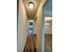 Inviting hallway with hardwood floors leading to a dining room with chandelier at 2832 Saratoga Lake Vw, Decatur, GA 30034