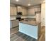 Well-equipped kitchen with stainless steel appliances, kitchen island, and granite countertops at 2832 Saratoga Lake Vw, Decatur, GA 30034