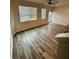 Open-concept living room with hardwood floors, neutral paint, lots of natural light, and ceiling fan at 2832 Saratoga Lake Vw, Decatur, GA 30034