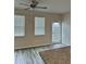 Bright living area featuring large windows, neutral walls, and hardwood floors for a modern look at 2832 Saratoga Lake Vw, Decatur, GA 30034