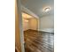 Bright living room with hardwood floors and modern chandelier at 2832 Saratoga Lake Vw, Decatur, GA 30034