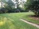 Expansive backyard featuring a playset and trampoline, perfect for outdoor fun at 3140 Kipling Dr, Powder Springs, GA 30127