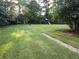 Expansive backyard featuring a playset and trampoline, perfect for outdoor fun at 3140 Kipling Dr, Powder Springs, GA 30127