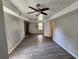 Spacious basement featuring wood-look floors, stone fireplace, and plenty of room for storage and activities at 3140 Kipling Dr, Powder Springs, GA 30127