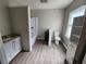 Bathroom with a shower-tub, toilet, vanity and white shelving unit at 3140 Kipling Dr, Powder Springs, GA 30127