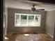 Inviting bedroom with a bay window and tile flooring for a warm and comforting interior at 3140 Kipling Dr, Powder Springs, GA 30127