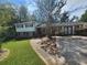 Charming two-story home with a well-maintained lawn, mature trees and long driveway at 3140 Kipling Dr, Powder Springs, GA 30127