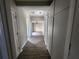 Hallway with hardwood floors leading into other parts of the home at 3140 Kipling Dr, Powder Springs, GA 30127