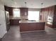 Spacious kitchen with stainless steel appliances, an island with a gas cooktop, and custom cabinetry at 3140 Kipling Dr, Powder Springs, GA 30127