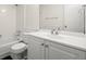 Clean bathroom features white cabinets, tile backsplash, and a shower-tub combination at 11006 Clearwater Dr, Hampton, GA 30228
