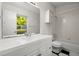 Clean bathroom with a white vanity, large mirror, and shower-tub combo at 11006 Clearwater Dr, Hampton, GA 30228