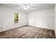 Bedroom featuring neutral carpet and a window offering natural light at 11006 Clearwater Dr, Hampton, GA 30228